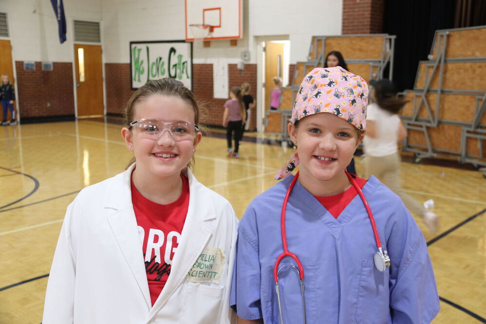 Two young kids dressed as doctors